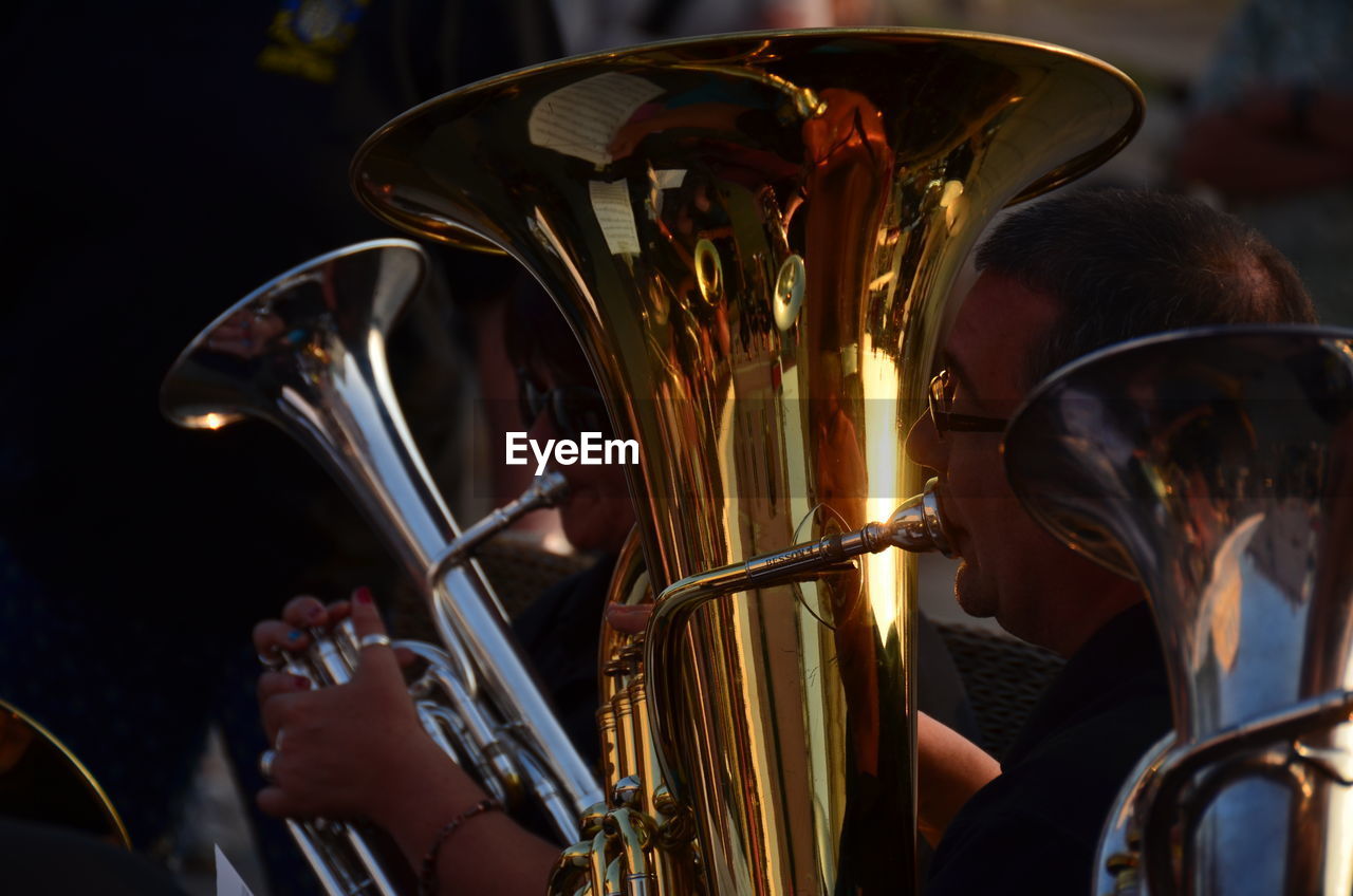 People playing tuba at music festival