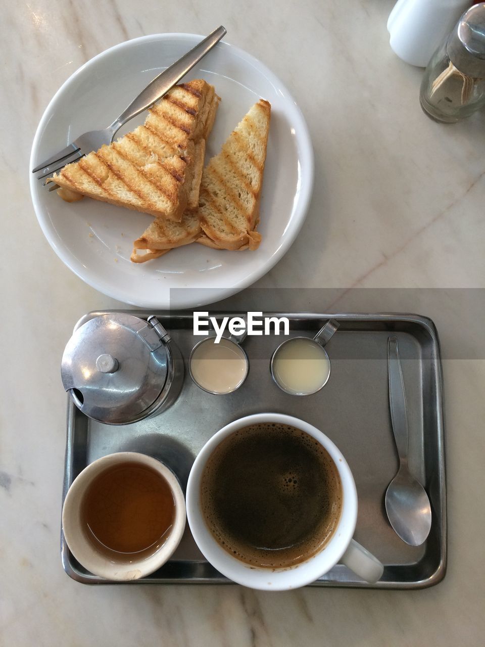 HIGH ANGLE VIEW OF BREAKFAST SERVED WITH COFFEE AND SPOON