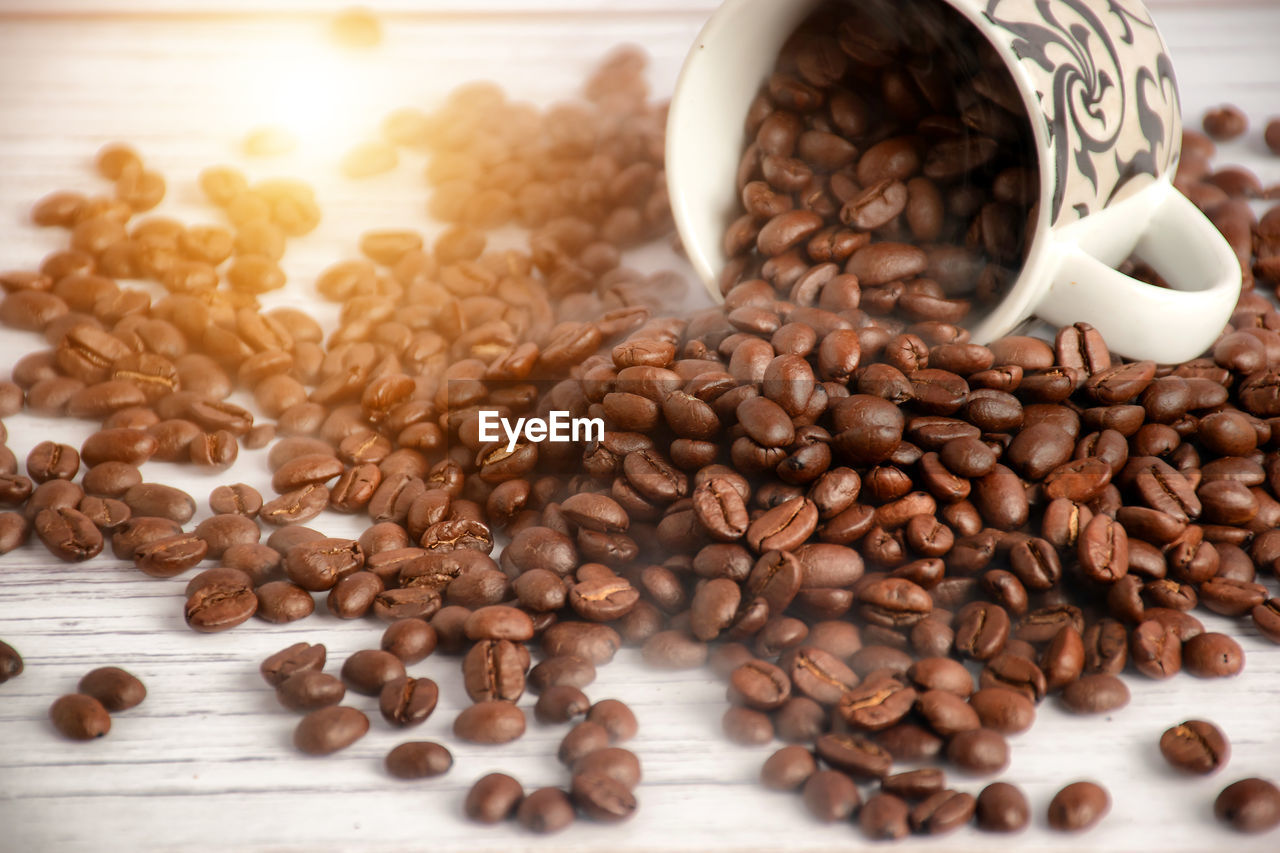 HIGH ANGLE VIEW OF COFFEE BEANS IN GLASS