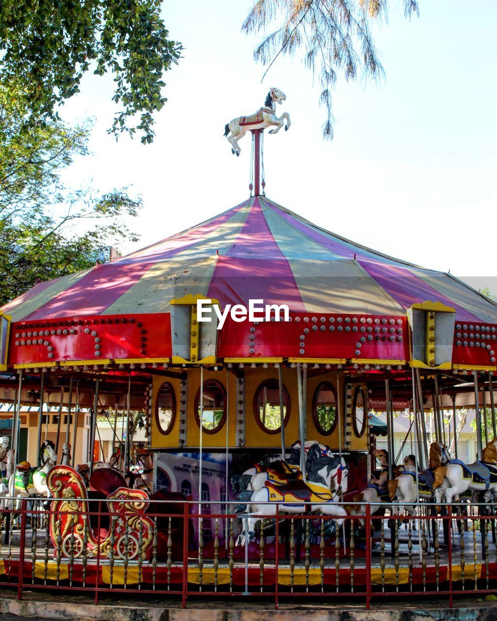 LOW ANGLE VIEW OF AMUSEMENT PARK AGAINST SKY