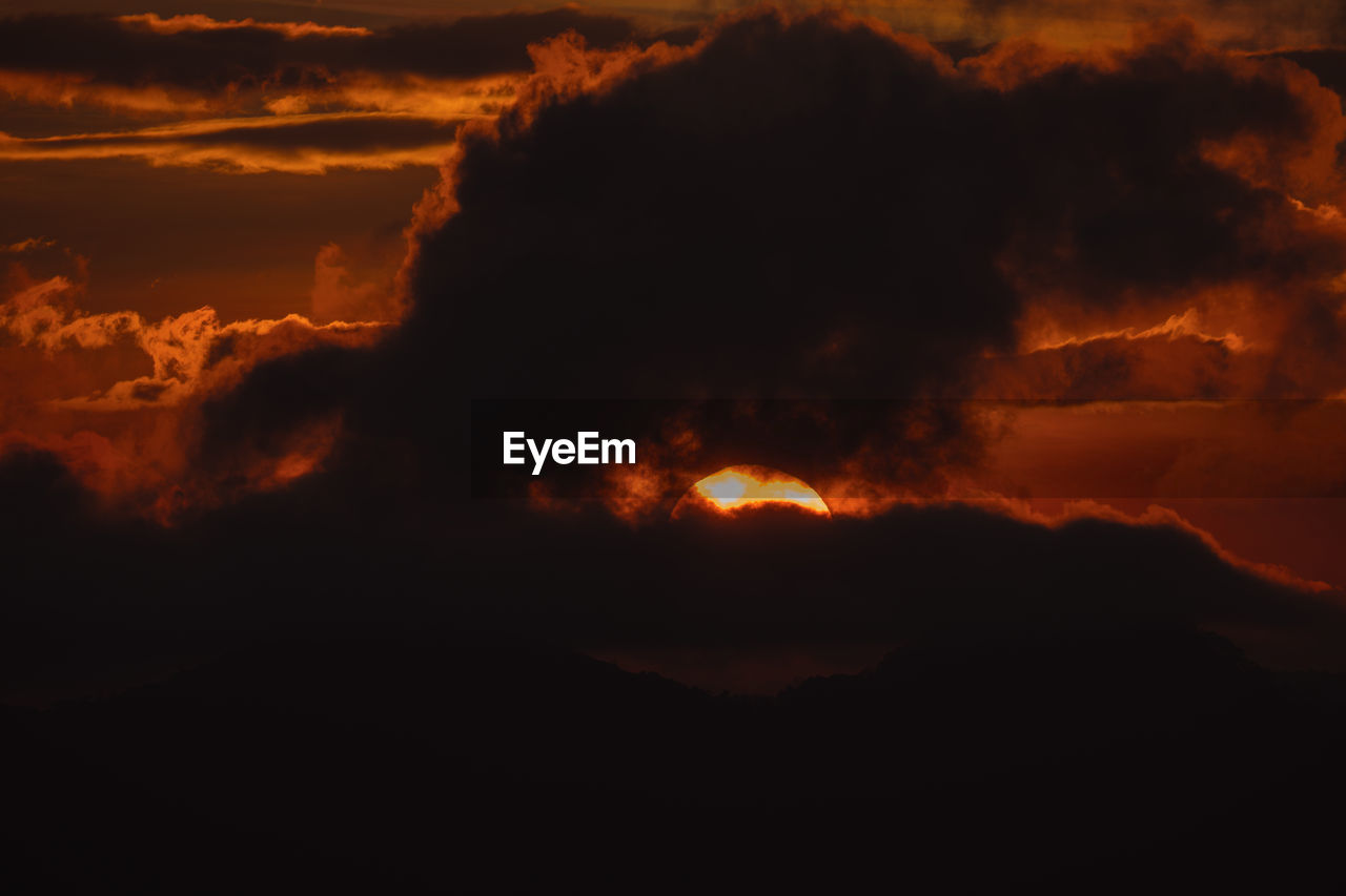cloud, nature, beauty in nature, sunset, no people, sky, environment, mountain, warning sign, night, burning, orange color, heat, lava, geology, power in nature, sign, dawn, land, outdoors, fire, volcano, scenics - nature, communication, smoke, afterglow, landscape, accidents and disasters