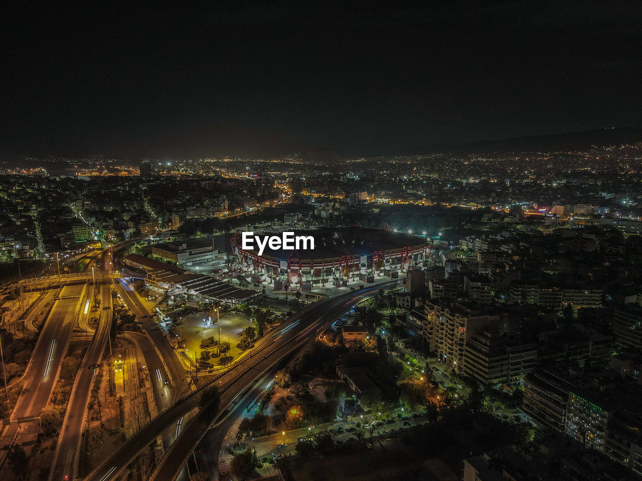 High angle view of illuminated city buildings at night