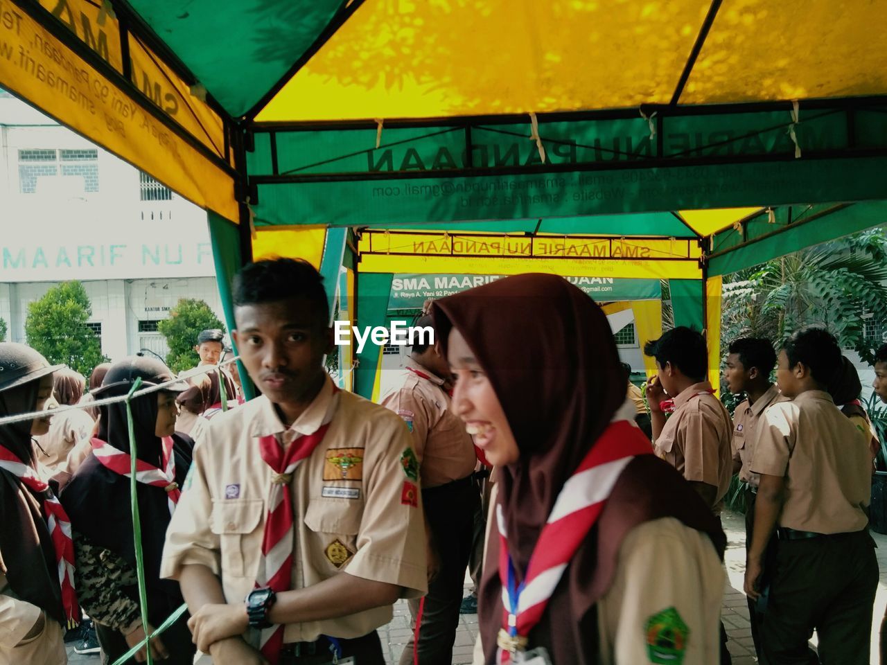 GROUP OF PEOPLE LOOKING AT BUS