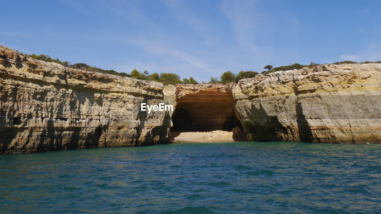 Scenic view to lonely beach between rock formation