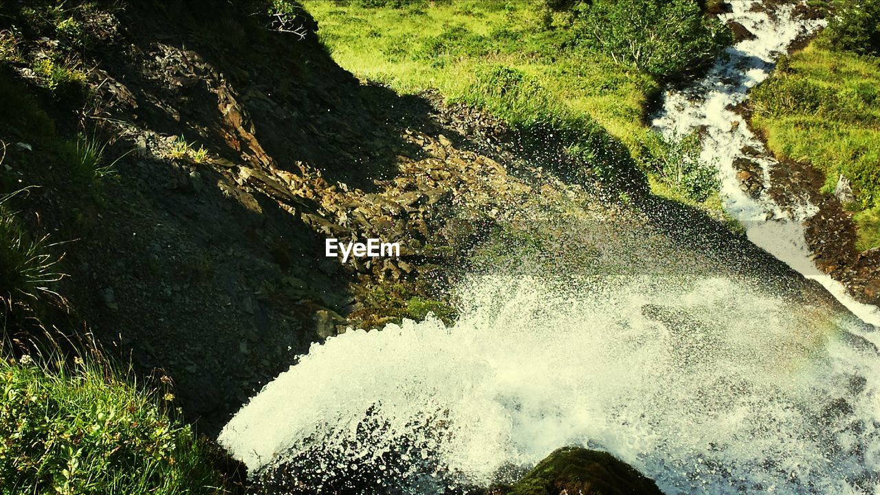 WATER FLOWING THROUGH ROCKS