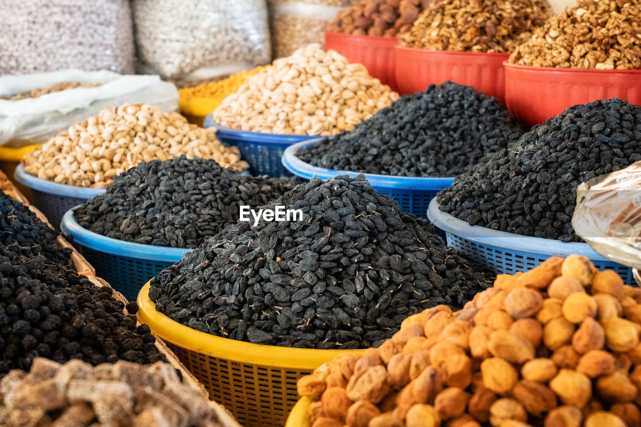 View of colorful sweets and nuts on showcase of local food market, uzbekistan	
