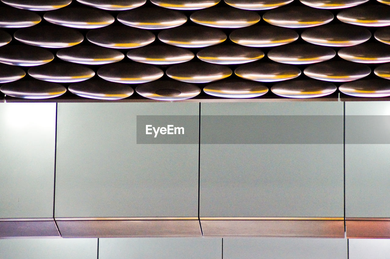 Low angle view of patterned ceiling at airport terminal