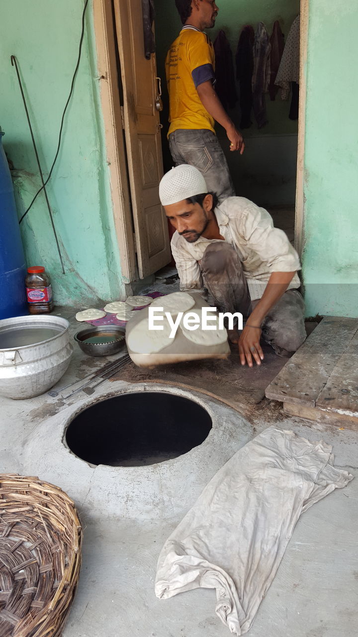 MAN WORKING IN WORKSHOP