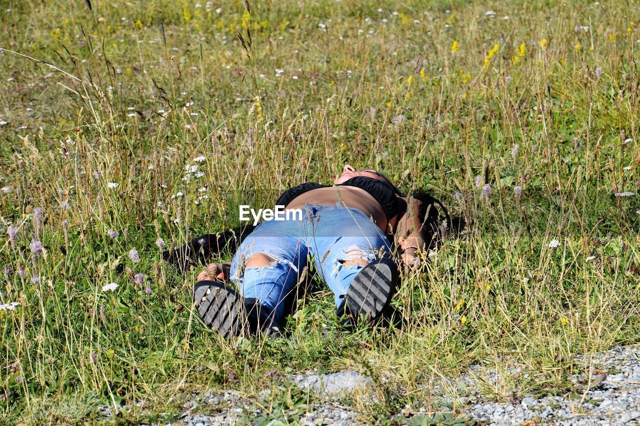 PEOPLE RELAXING ON GRASS