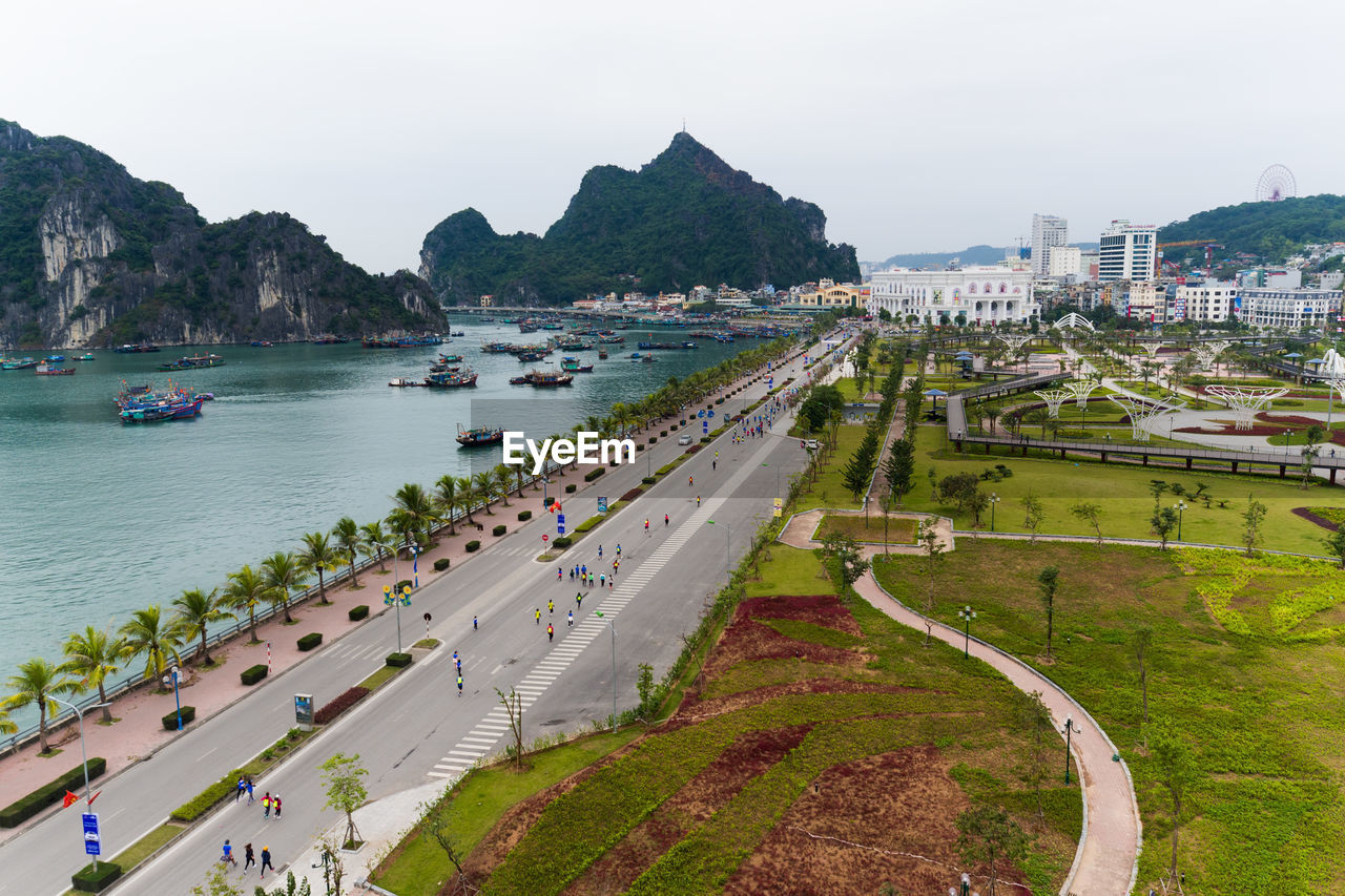 High angle view of road by sea in city