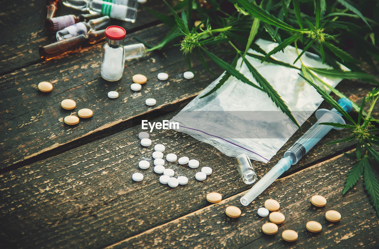 high angle view of medicines on wooden table