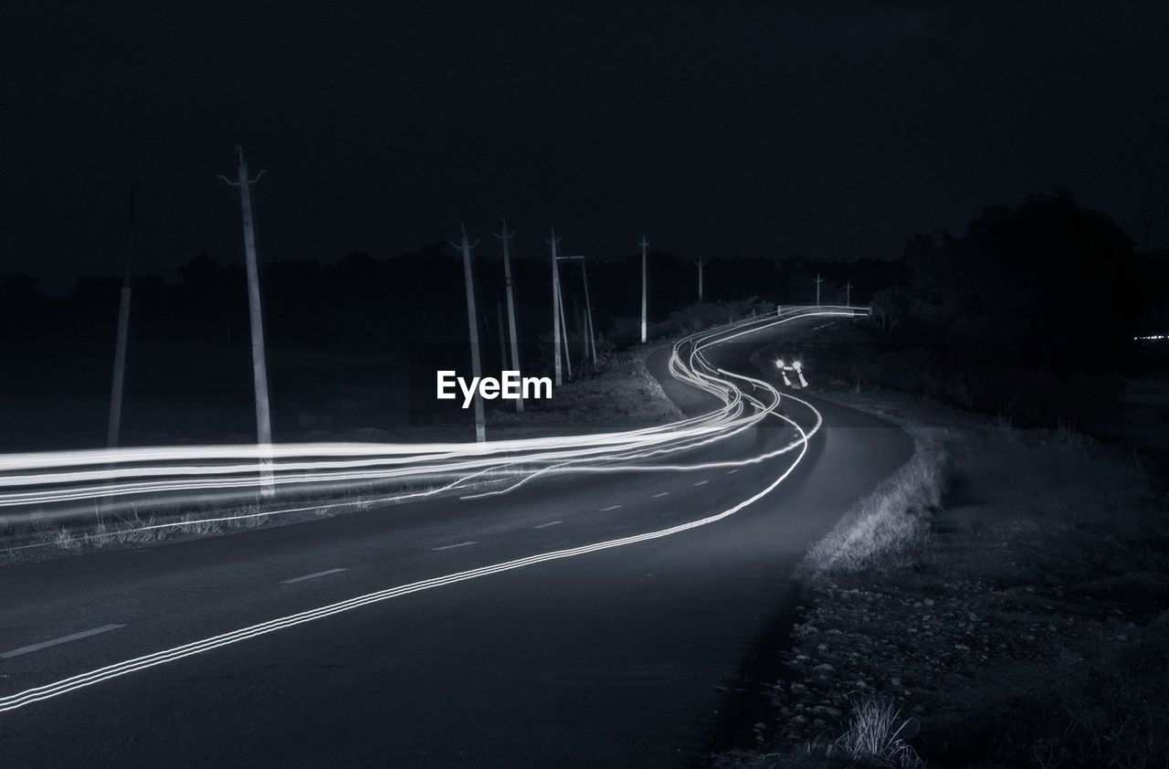 Light trails on road at night