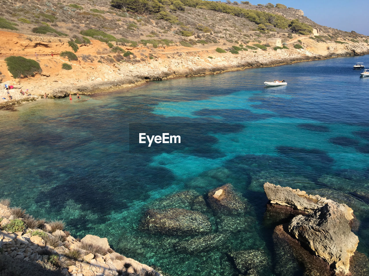 High angle view of rocks by sea