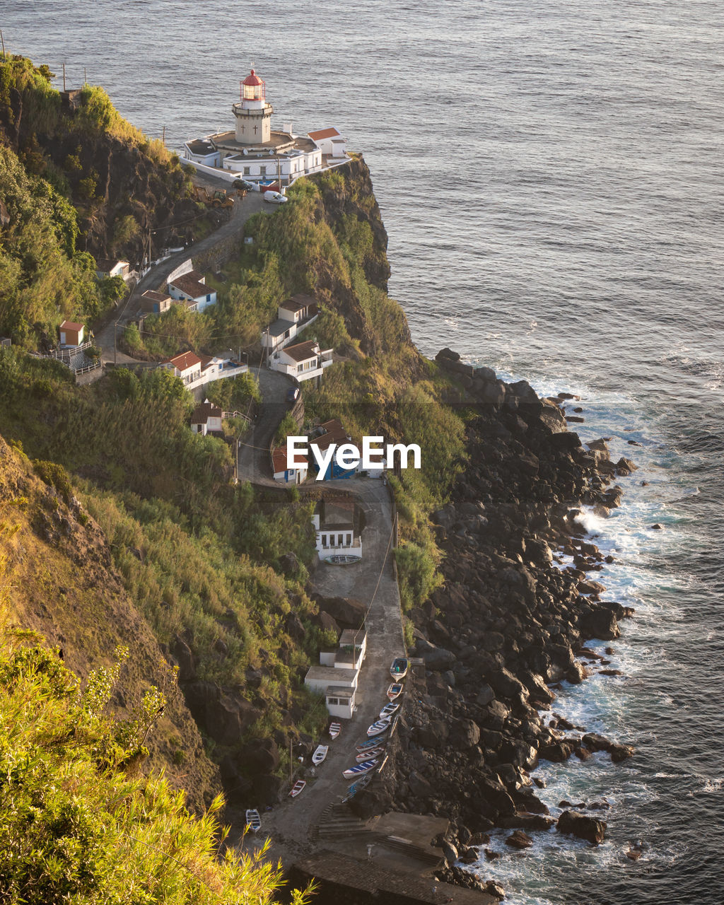 View of farol do arnel, the oldest lighthouse on sao miguel island, azores