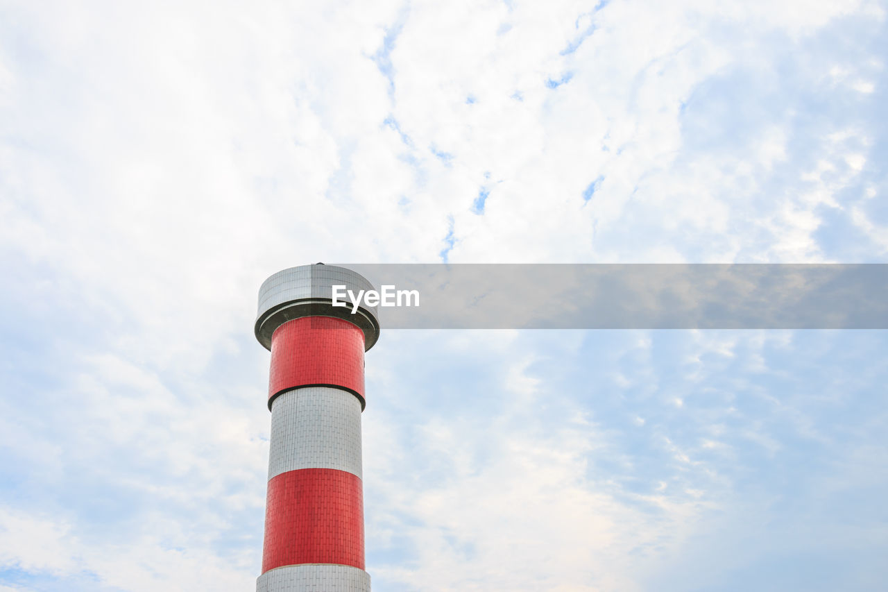 Low angle view of smoke stack against sky