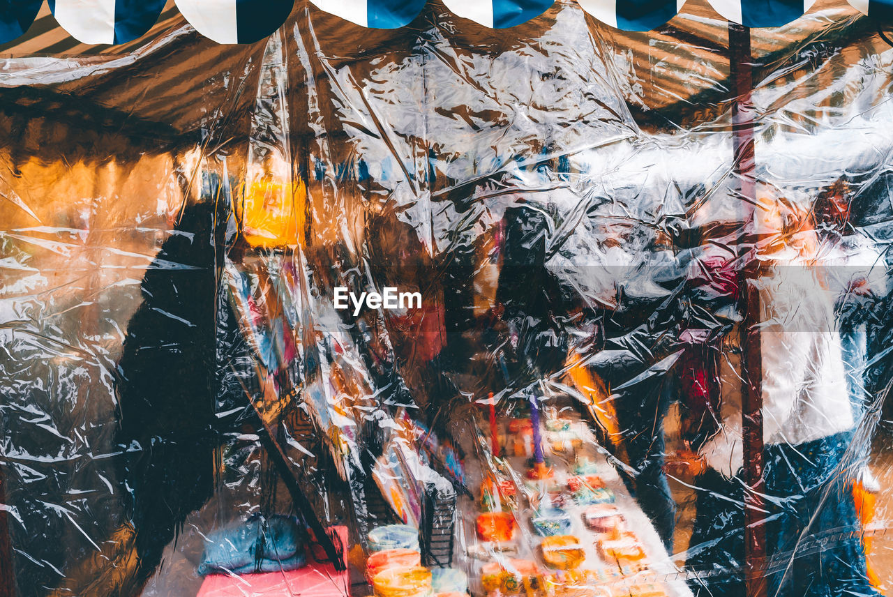 Low angle view of people standing in market