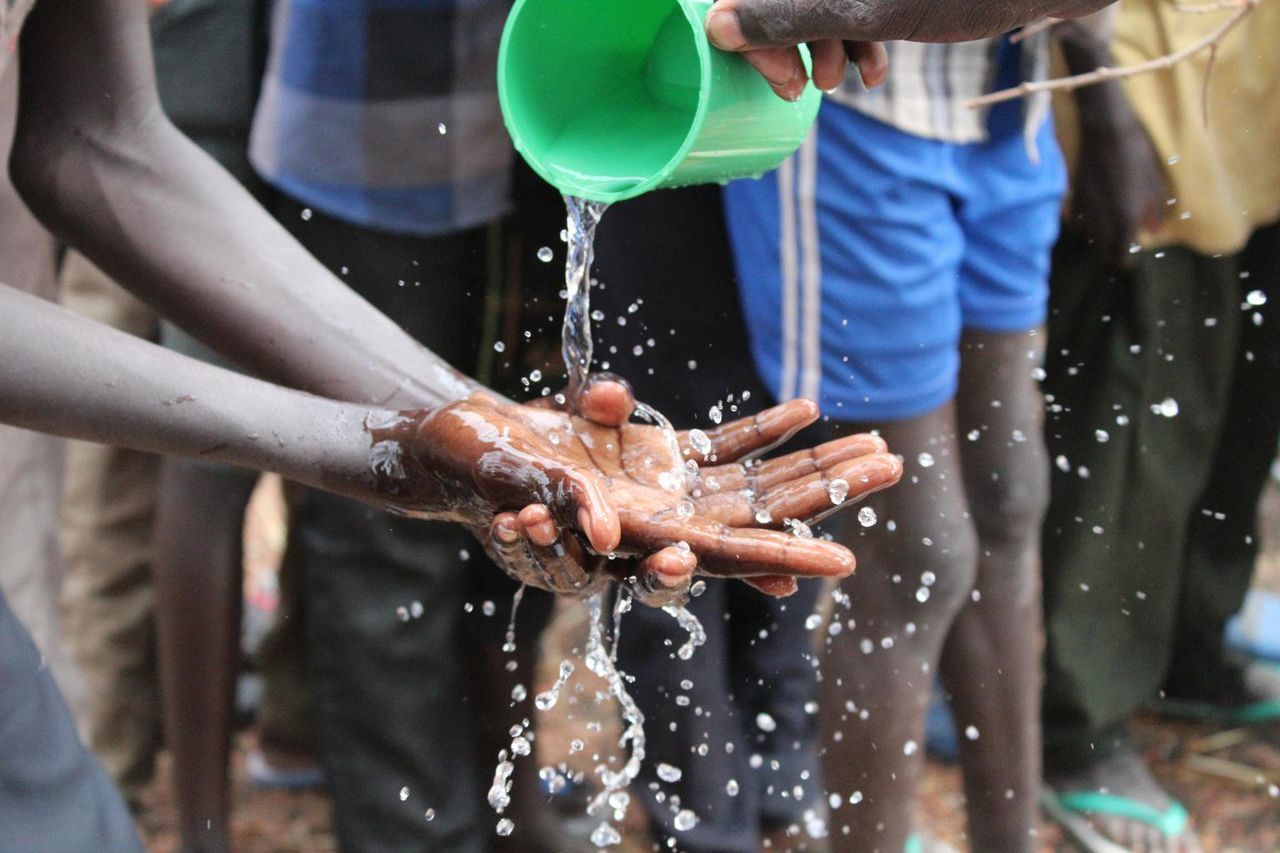 Close-up of person cleaning hands