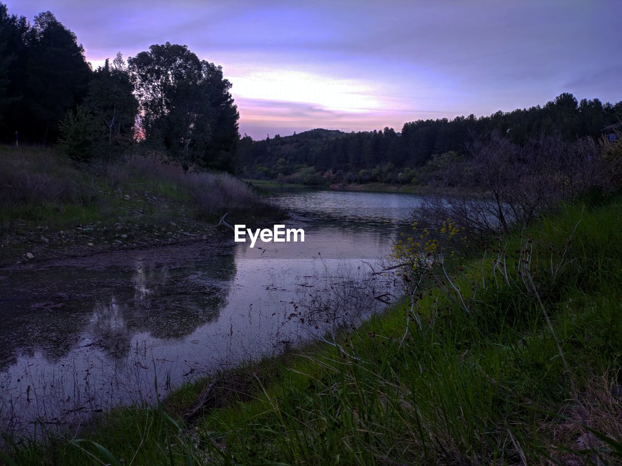 SCENIC VIEW OF LAKE DURING SUNSET