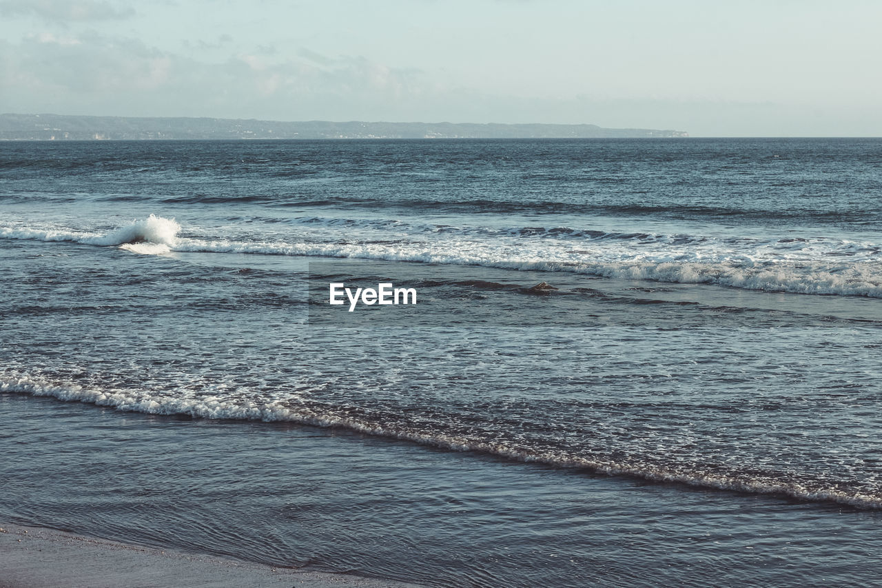 SCENIC VIEW OF SEA SHORE AGAINST SKY