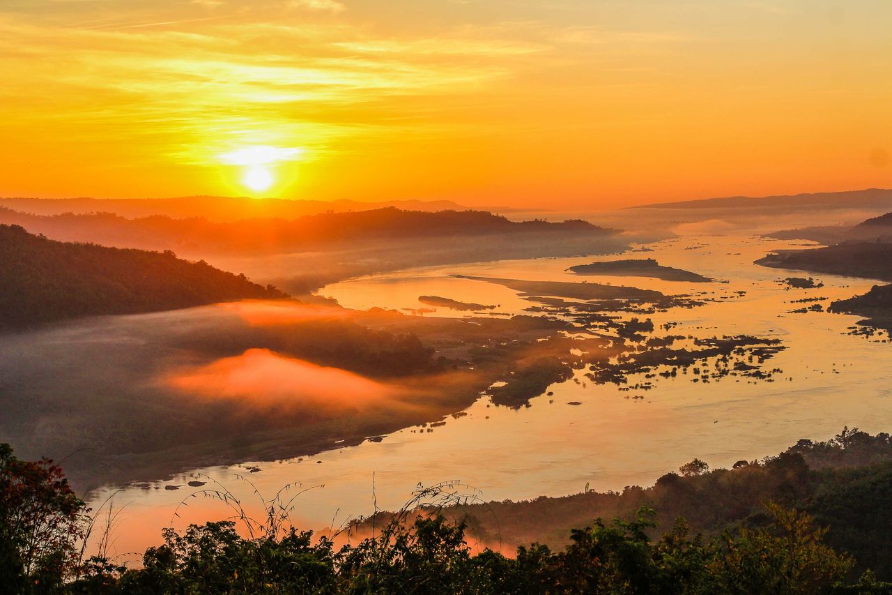 SCENIC VIEW OF SUNSET OVER MOUNTAINS