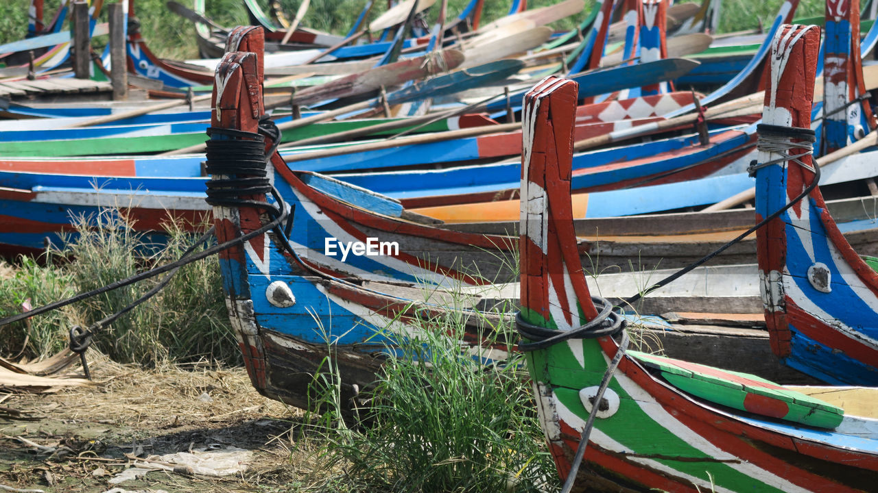 BOATS MOORED ON SHORE