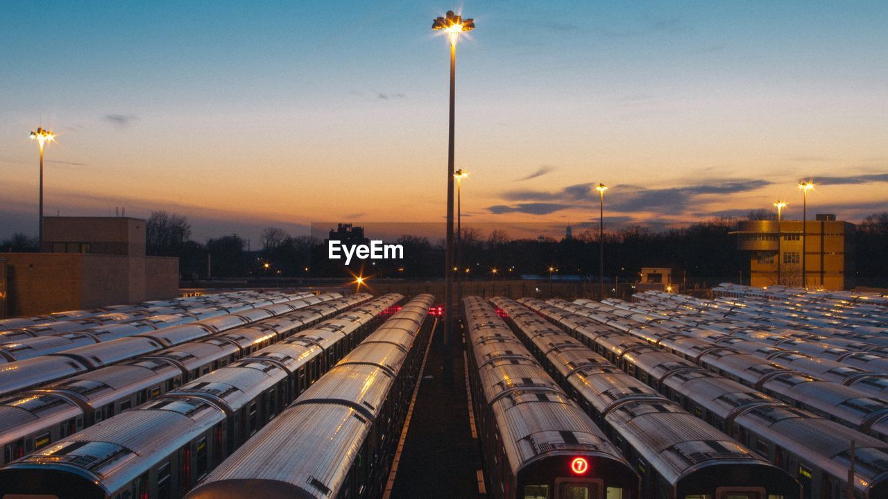 High angle view of trains against sky during sunset