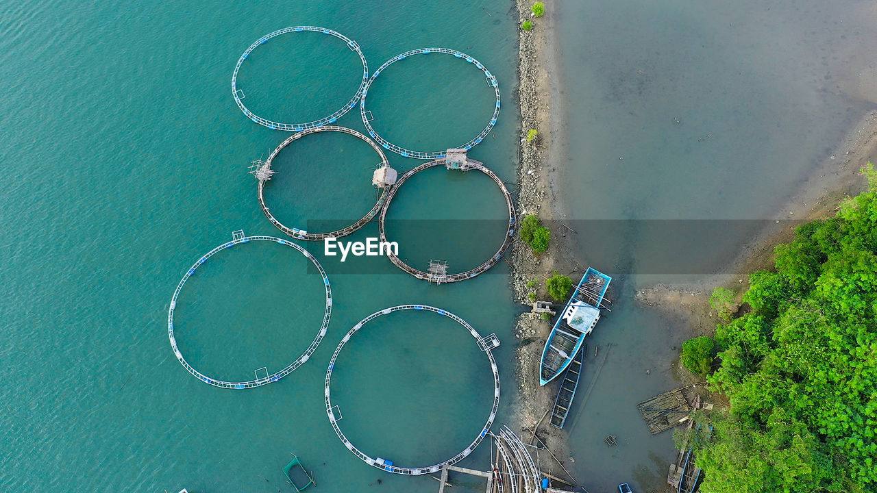 Fishing industry. fish farming on an industrial scale. large scale traditional floating fish farms.