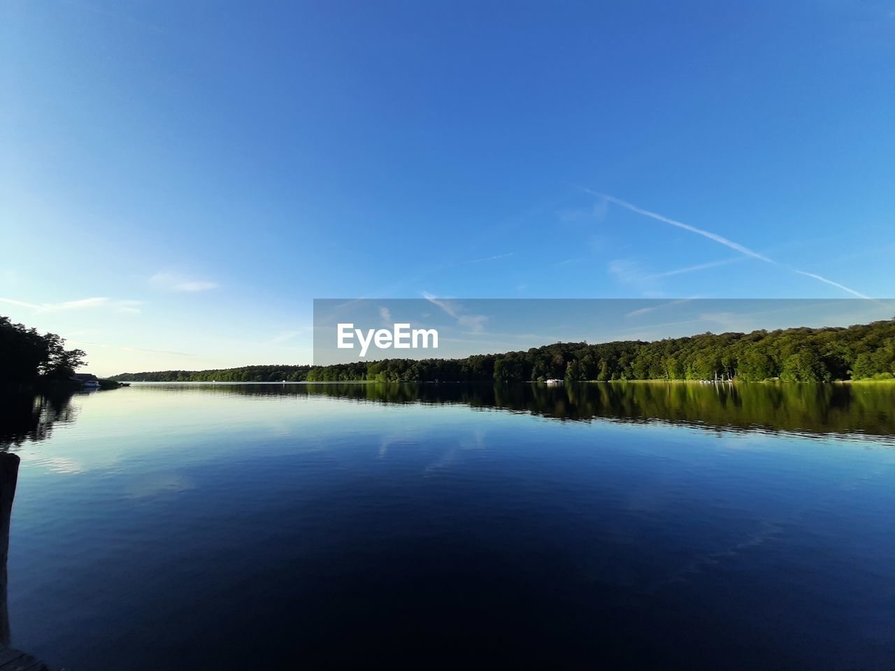 reflection, sky, water, tree, scenics - nature, tranquility, beauty in nature, lake, nature, tranquil scene, plant, blue, horizon, dusk, body of water, no people, morning, environment, sunlight, forest, landscape, cloud, non-urban scene, land, idyllic, outdoors, day, clear sky, reservoir, copy space, travel destinations, mountain