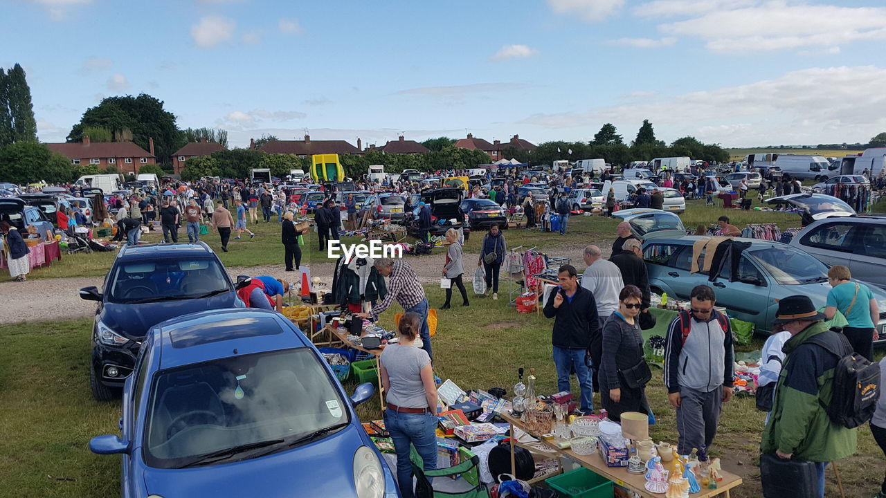 PEOPLE AT STADIUM AGAINST SKY