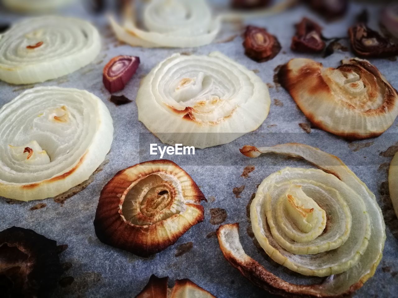 Full frame shot of roasted onions on marble