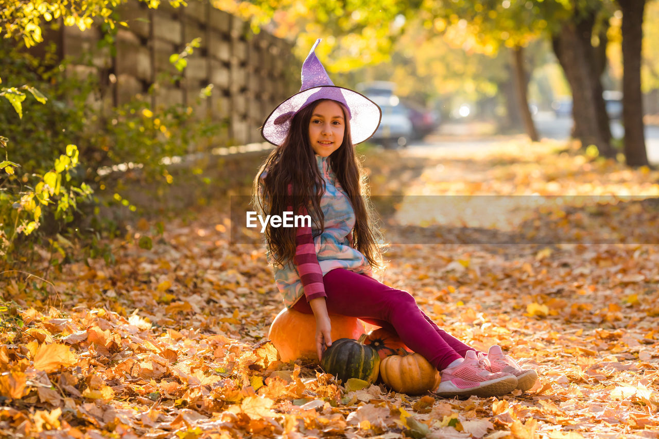 portrait of woman sitting on field