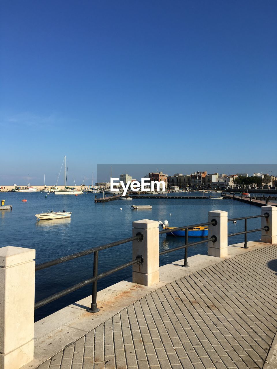 High angle view of boats on river against blue sky