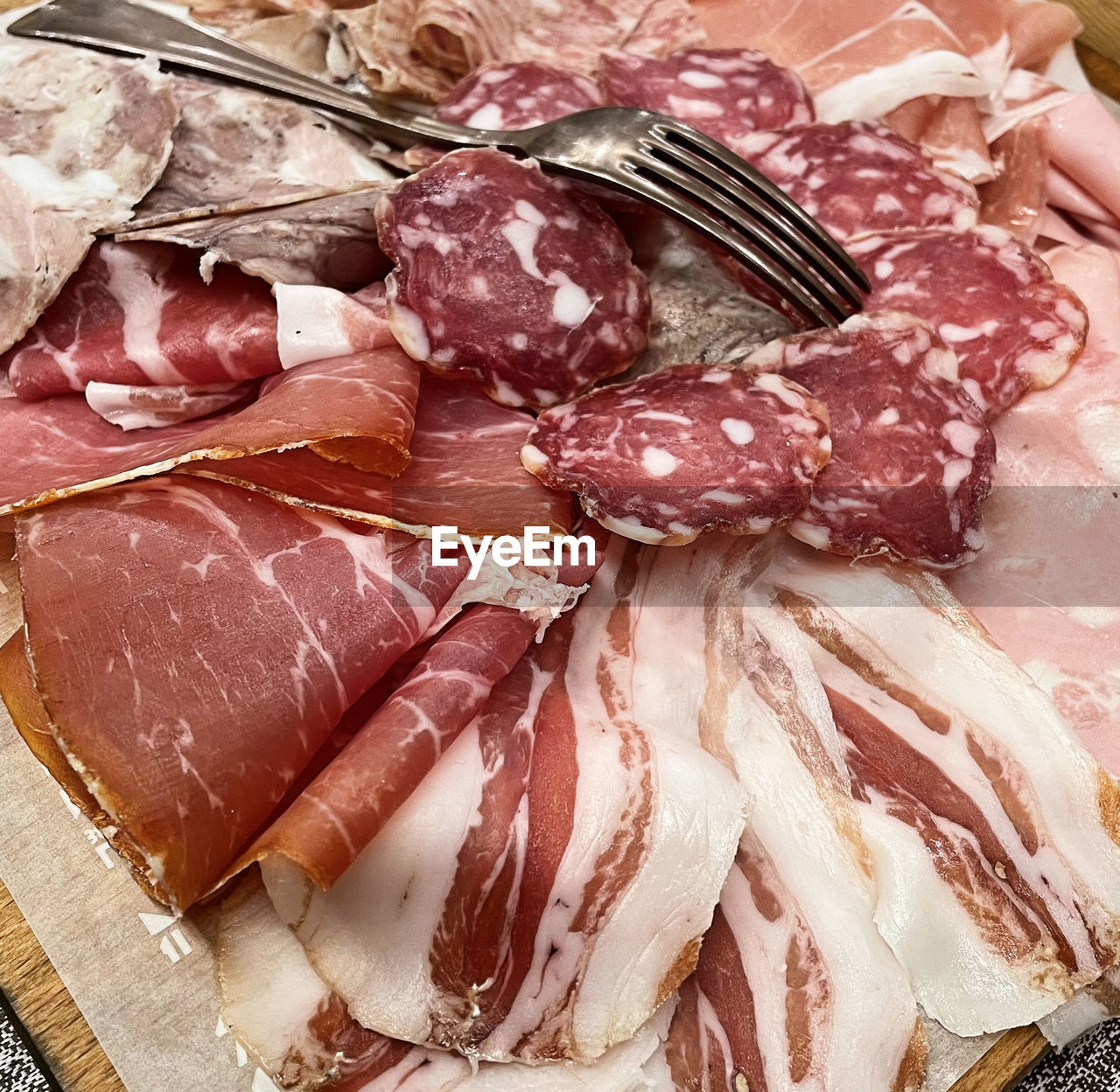 Tray with typical italian salami. platter of assorted cured meat.