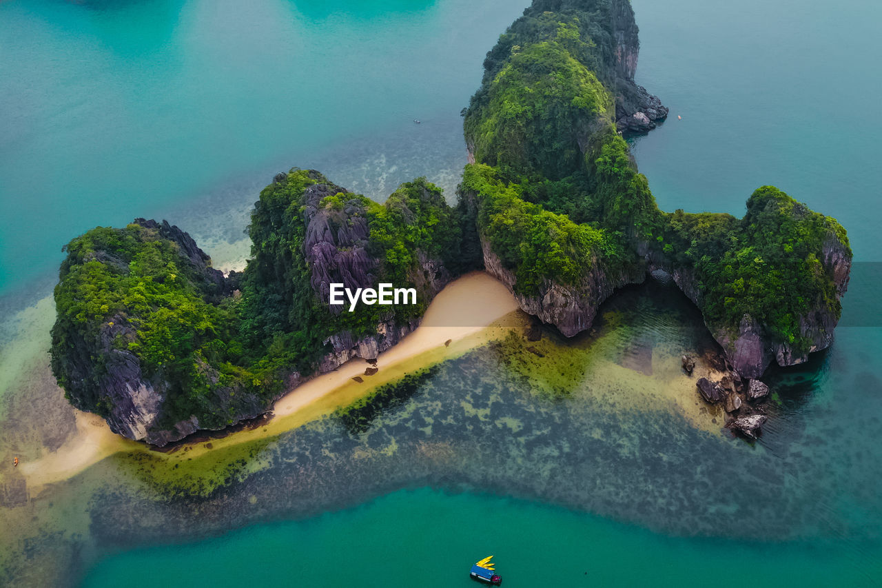 High angle view of rocks on sea shore