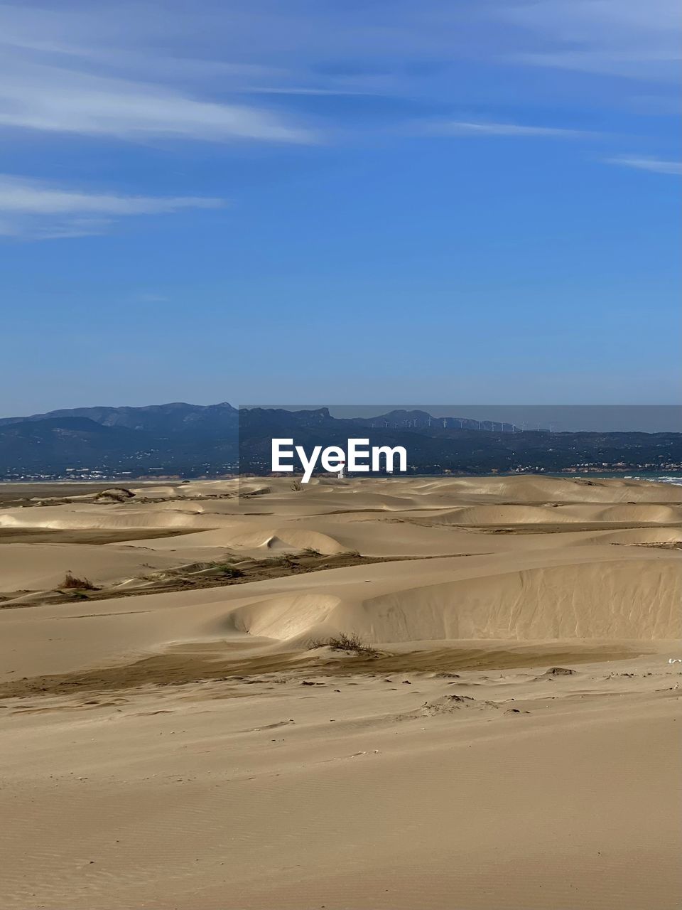 land, scenics - nature, sand, sky, landscape, environment, natural environment, beauty in nature, nature, sand dune, desert, tranquility, tranquil scene, non-urban scene, beach, sea, erg, water, dune, travel destinations, cloud, travel, blue, no people, tourism, day, mountain, arid climate, climate, outdoors, animal wildlife, remote, horizon, animal, sunlight, idyllic, horizon over land, vacation, nature reserve, trip, physical geography, solitude, clear sky, holiday, animal themes, absence, semi-arid, singing sand, sunny