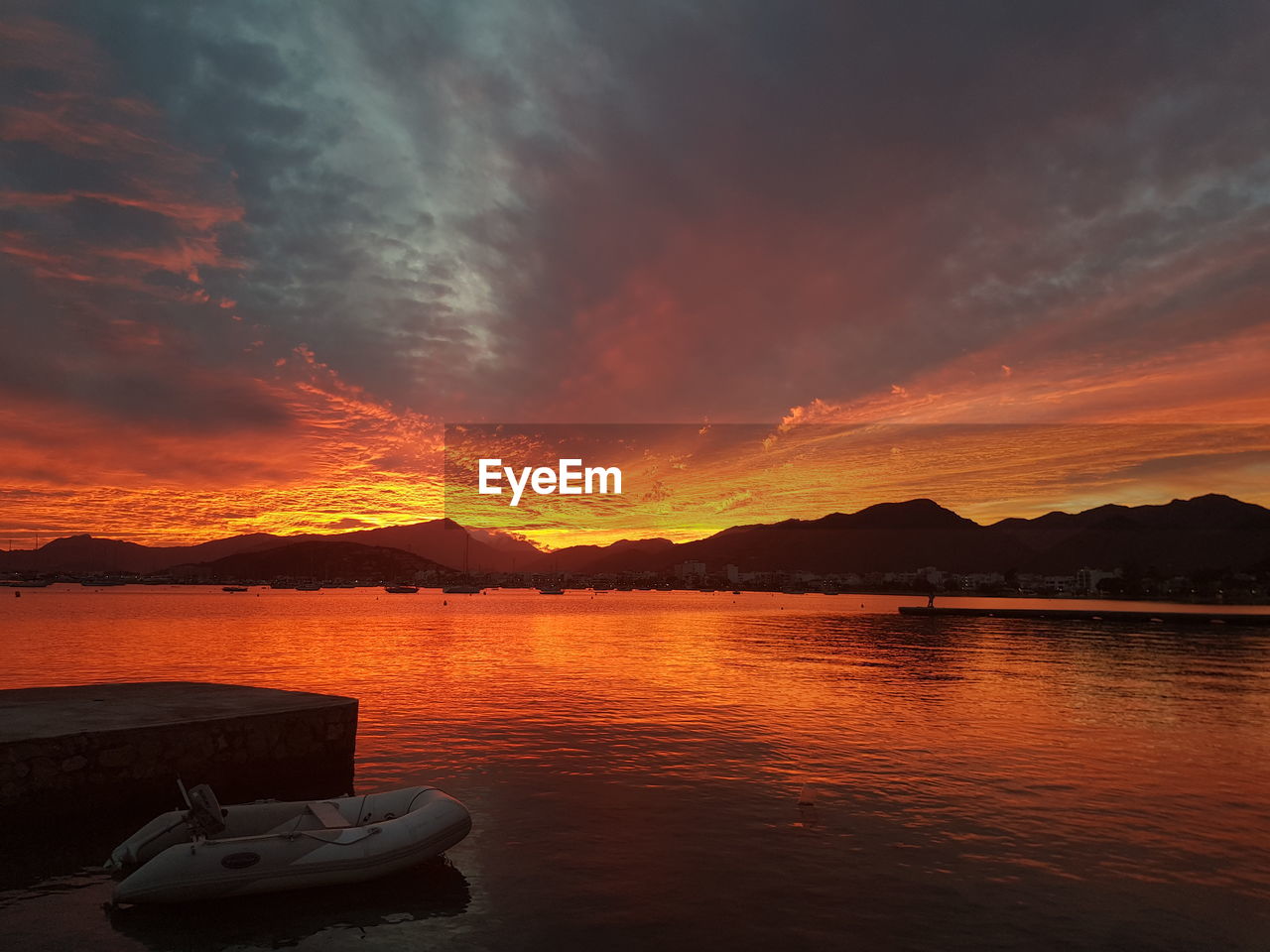 Scenic view of lake against sky during sunset