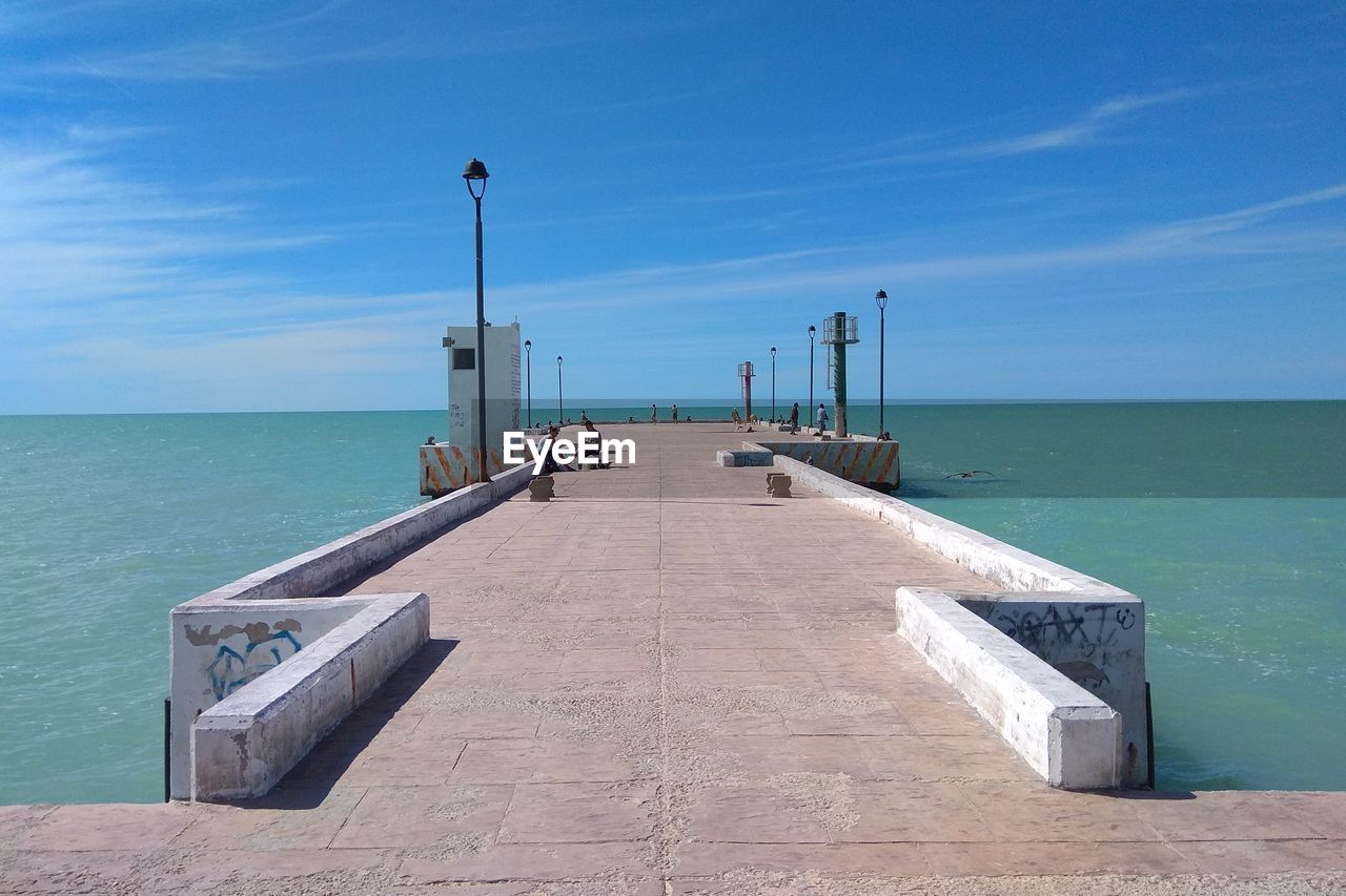 Pier over sea against sky