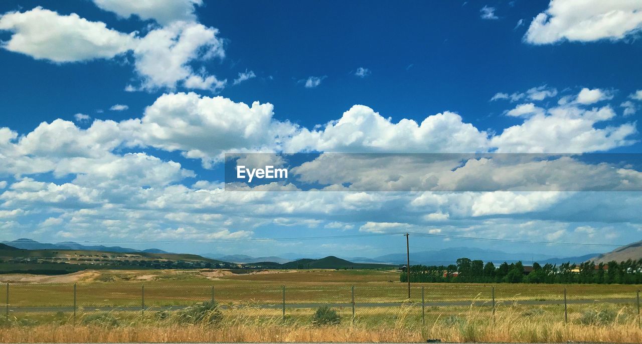 SCENIC VIEW OF FARM FIELD AGAINST SKY