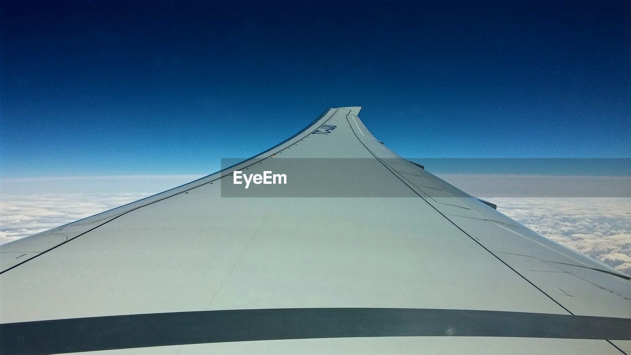 Aircraft wing in sky