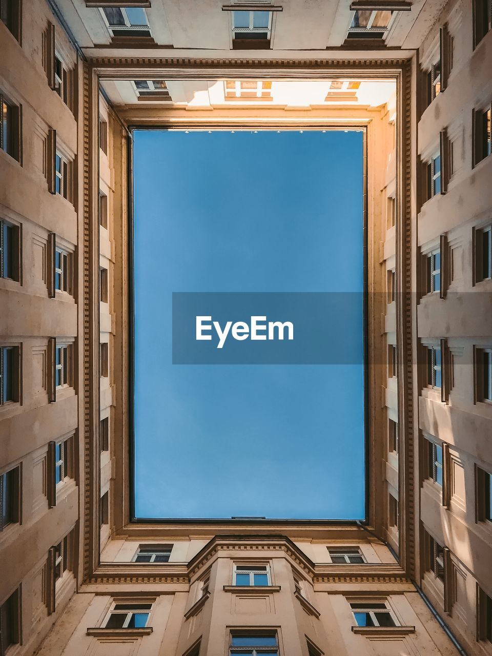 Low angle view of buildings against blue sky