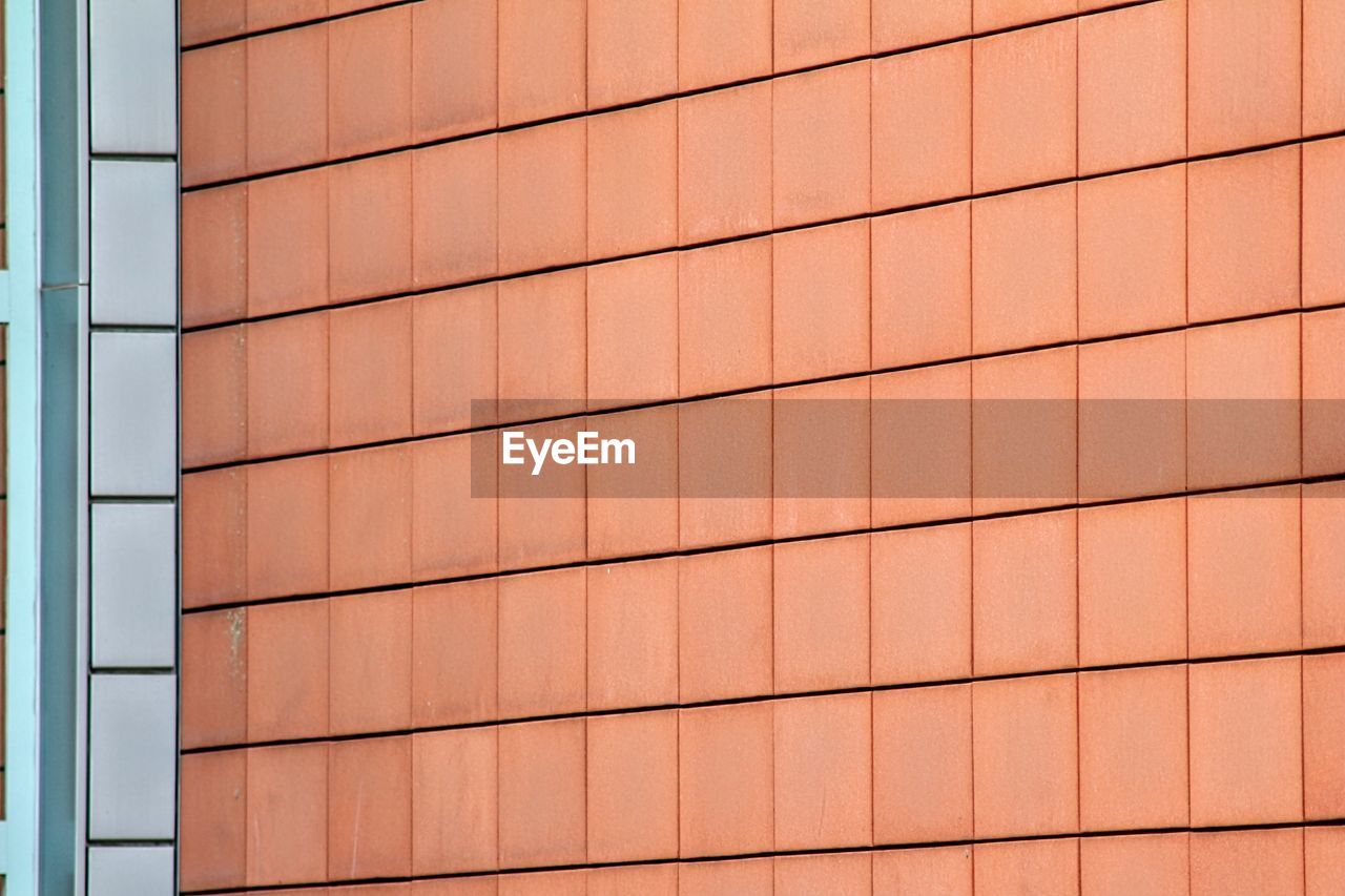 Full frame shot of roof and wall tiles minimal architecture