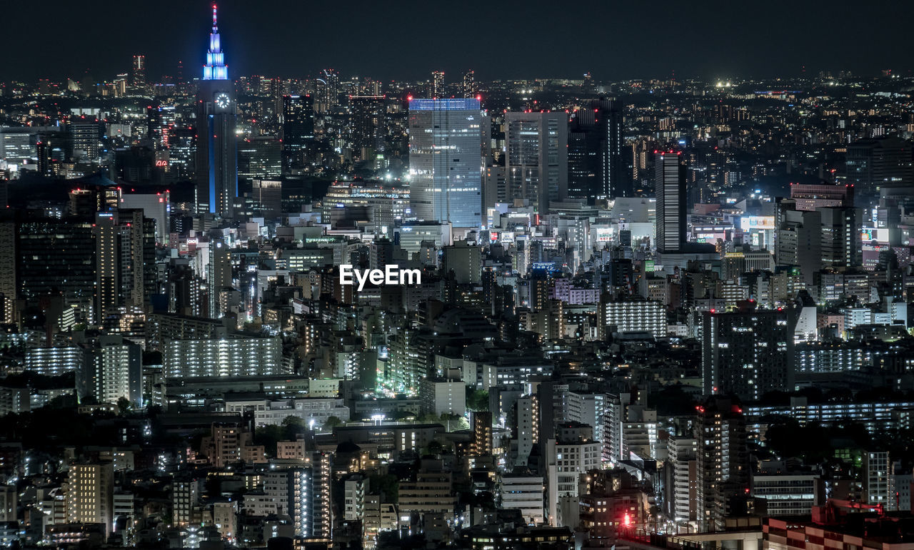 High angle view of illuminated city buildings at night