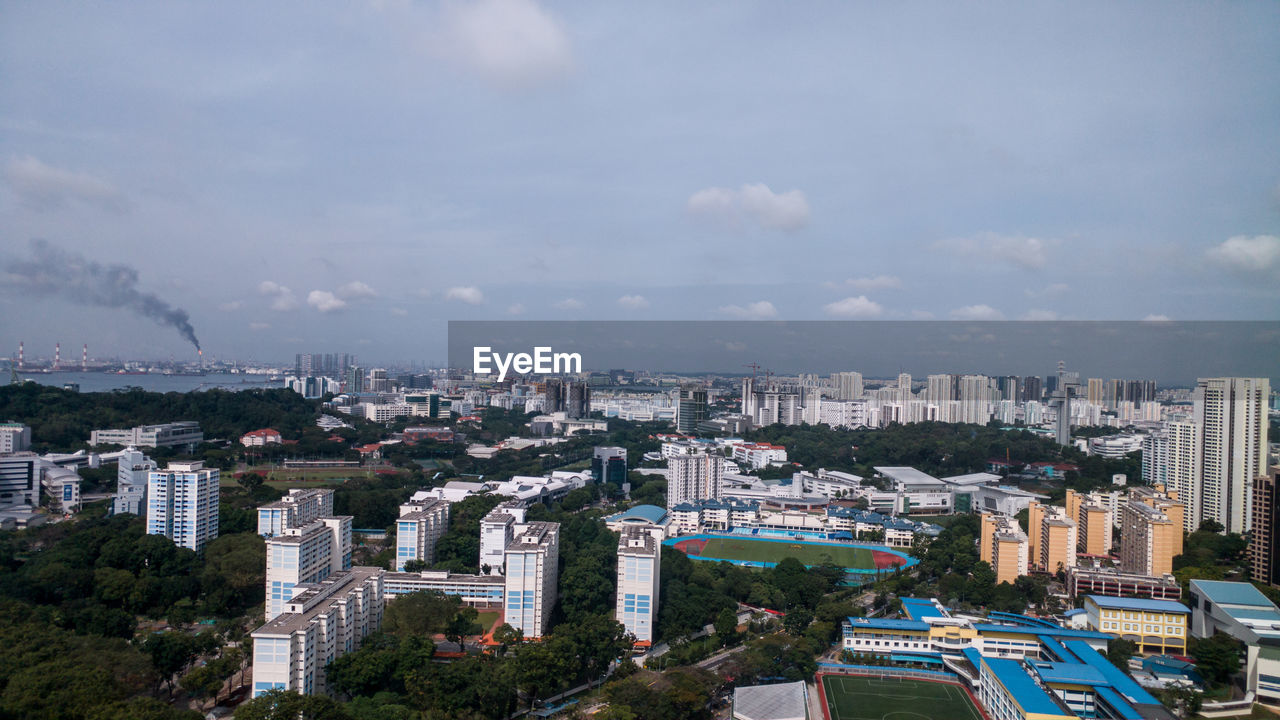 Aerial view of cityscape against sky