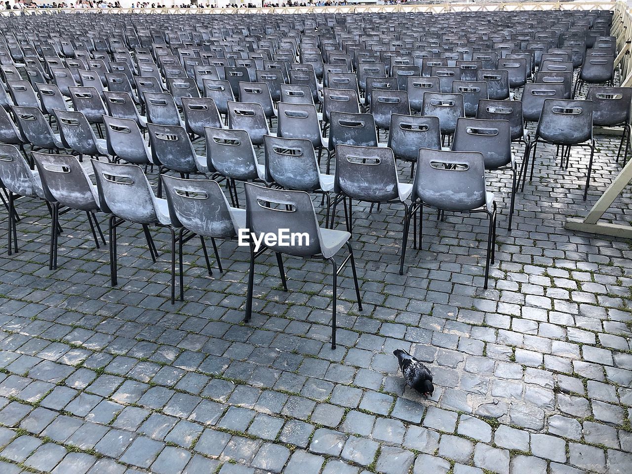 High angle view of empty chairs on street