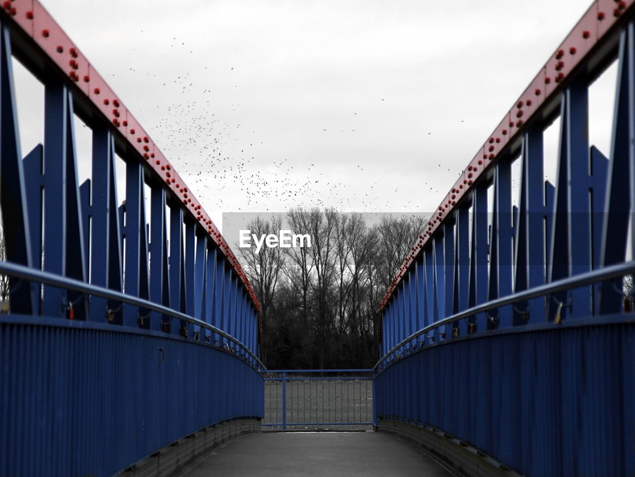 Bridge over footbridge against sky