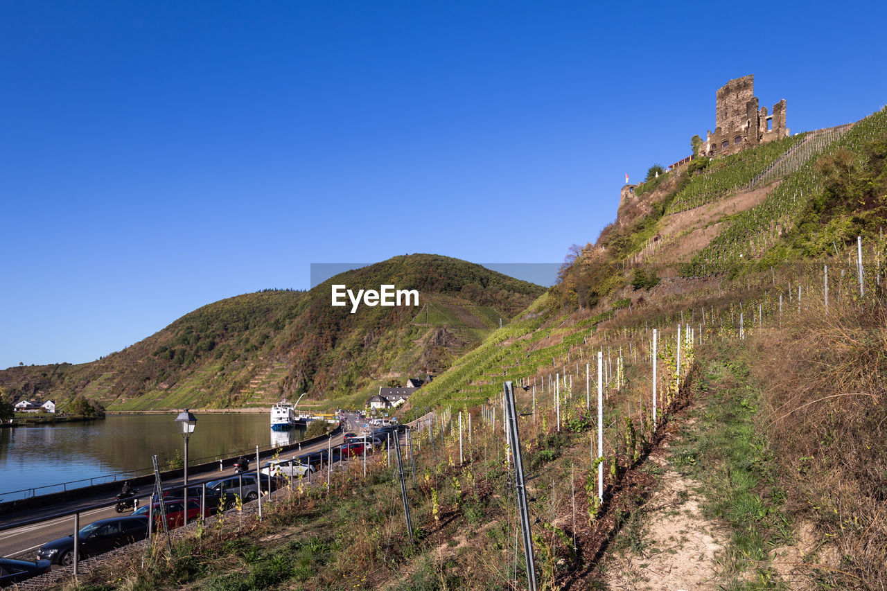 Scenic view of mountains against clear blue sky