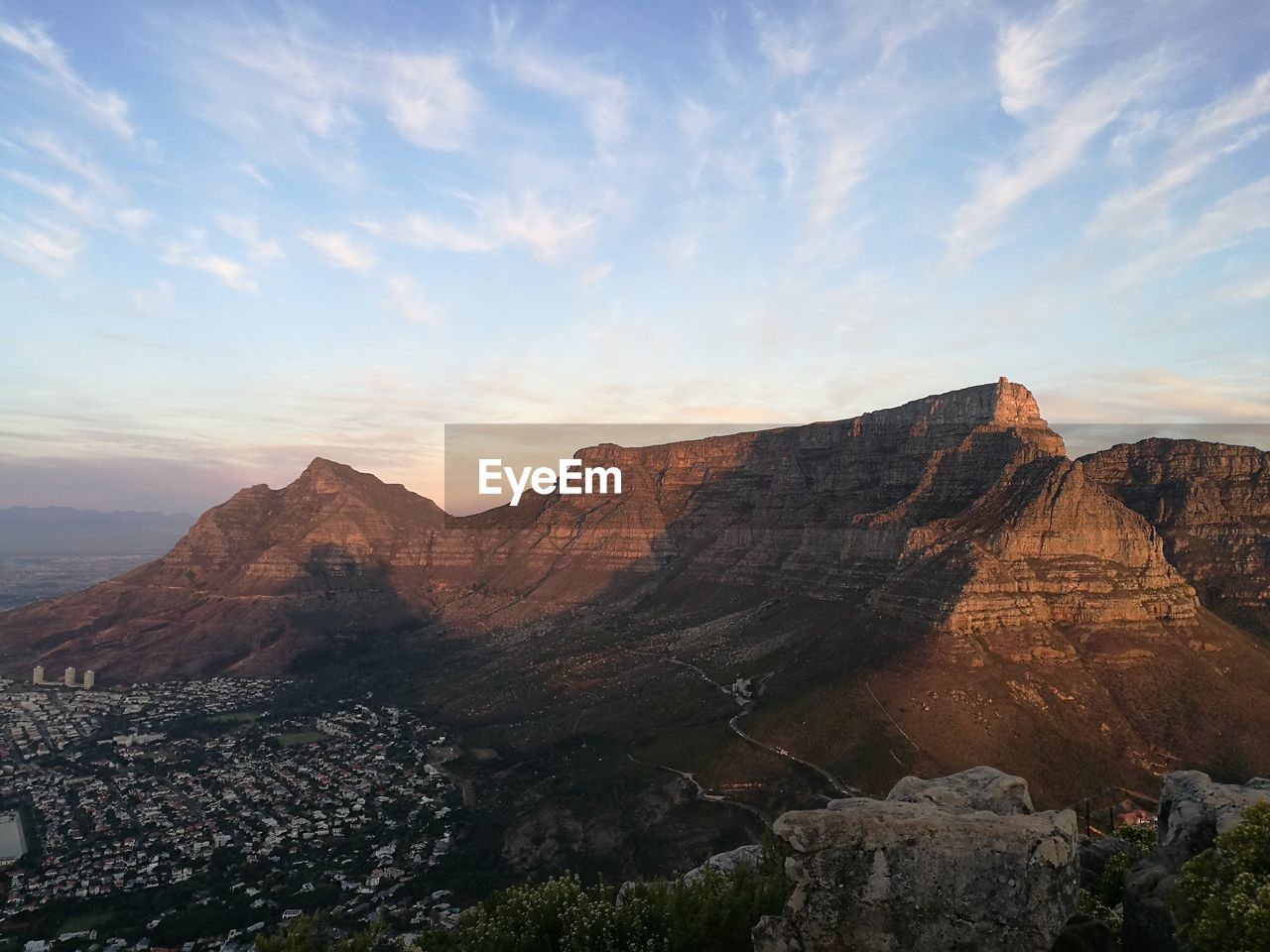 Scenic view of mountain against cloudy sky