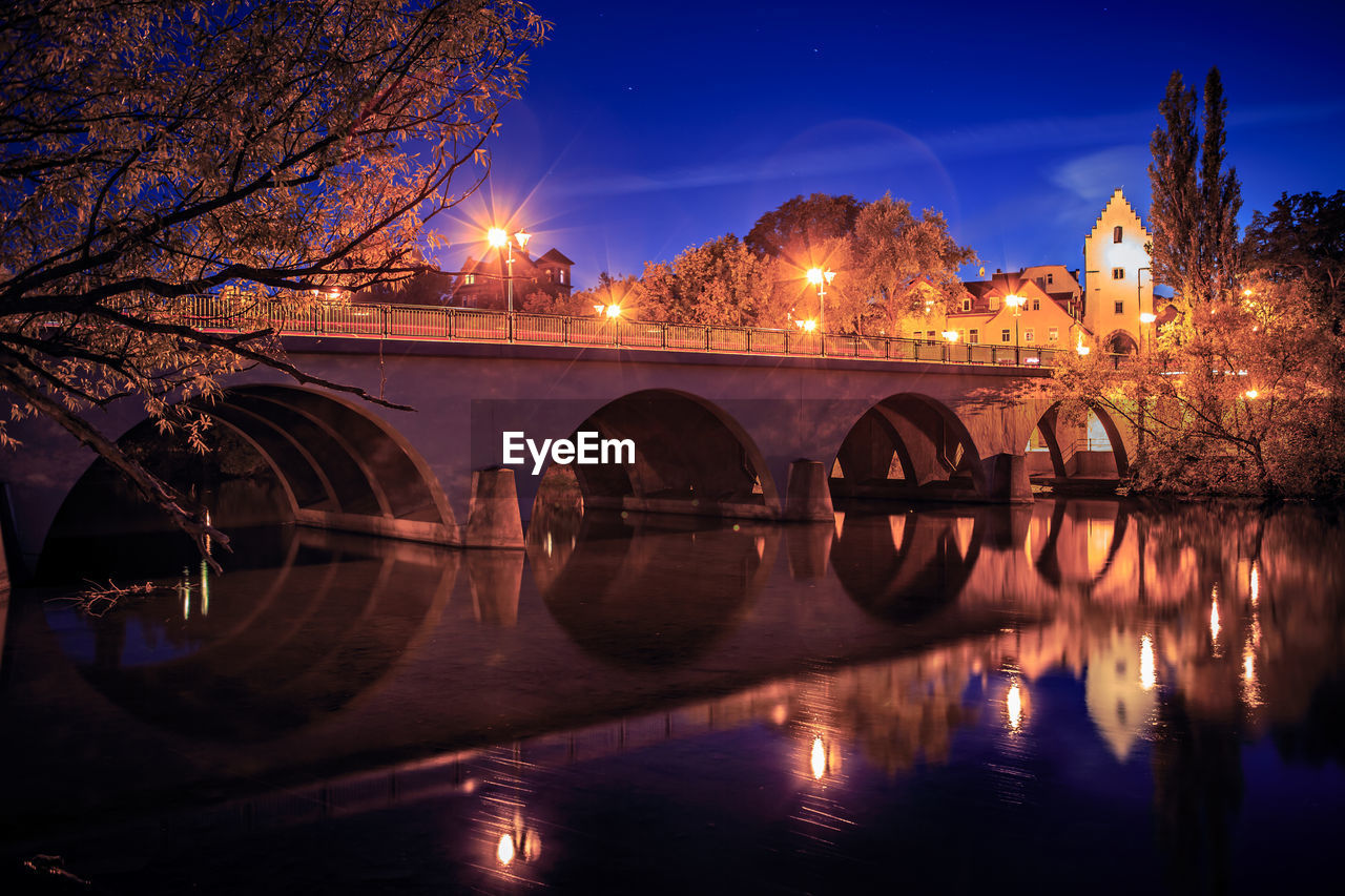 Bridge over river at night