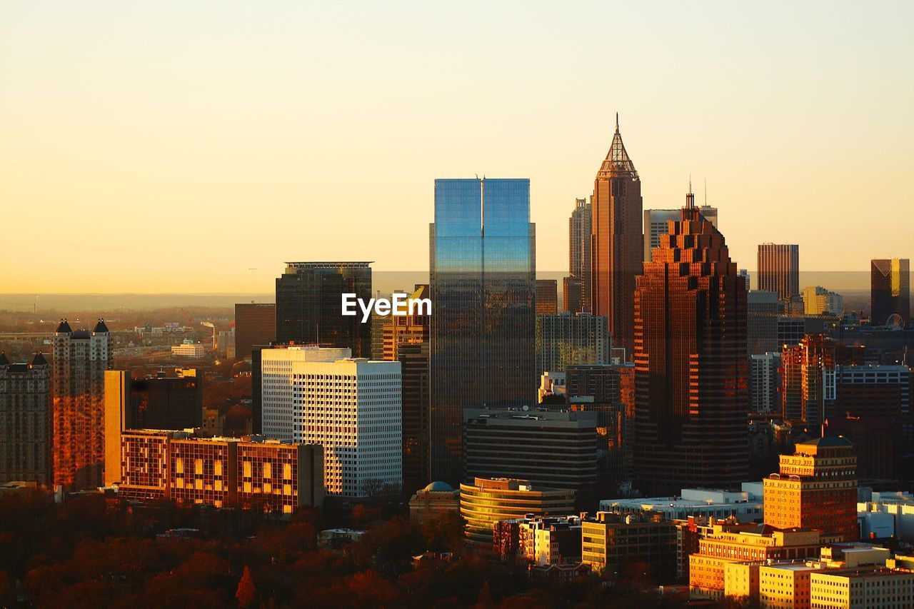 High angle view of city at sunset