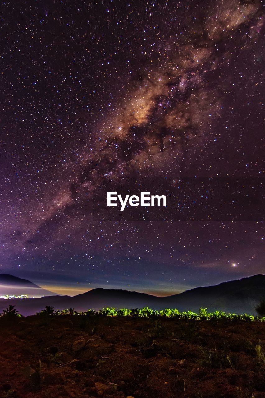 Scenic view of star field against sky at night